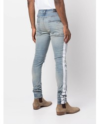 hellblaue enge Jeans mit Destroyed-Effekten von Amiri