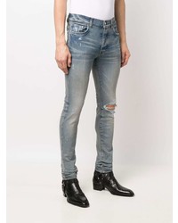 hellblaue enge Jeans mit Destroyed-Effekten von Amiri