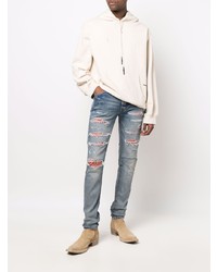 hellblaue enge Jeans mit Destroyed-Effekten von Amiri