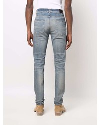 hellblaue enge Jeans mit Destroyed-Effekten von Amiri