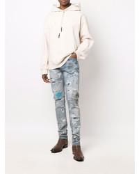 hellblaue enge Jeans mit Destroyed-Effekten von Amiri