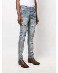 hellblaue enge Jeans mit Destroyed-Effekten von Amiri