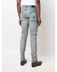 hellblaue enge Jeans mit Destroyed-Effekten von Amiri