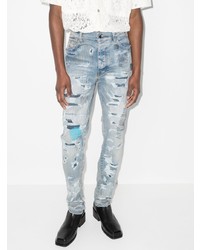 hellblaue enge Jeans mit Destroyed-Effekten von Amiri