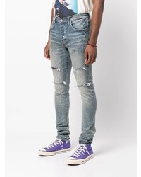 hellblaue enge Jeans mit Destroyed-Effekten von purple brand