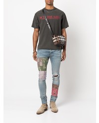 hellblaue enge Jeans mit Destroyed-Effekten von Amiri