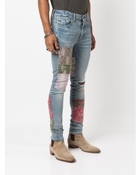 hellblaue enge Jeans mit Destroyed-Effekten von Amiri