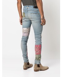 hellblaue enge Jeans mit Destroyed-Effekten von Amiri