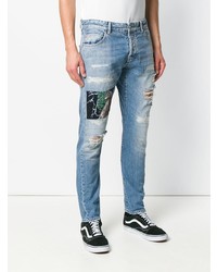 hellblaue enge Jeans mit Destroyed-Effekten von Marcelo Burlon County of Milan