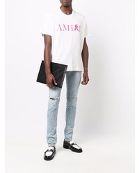 hellblaue enge Jeans mit Destroyed-Effekten von Amiri