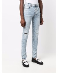 hellblaue enge Jeans mit Destroyed-Effekten von Amiri