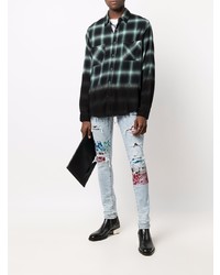 hellblaue enge Jeans mit Destroyed-Effekten von Amiri