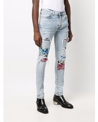 hellblaue enge Jeans mit Destroyed-Effekten von Amiri