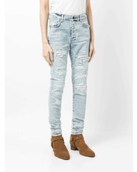 hellblaue enge Jeans mit Destroyed-Effekten von Amiri