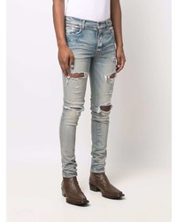 hellblaue enge Jeans mit Destroyed-Effekten von Amiri