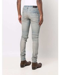 hellblaue enge Jeans mit Destroyed-Effekten von Amiri