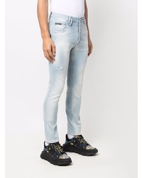 hellblaue enge Jeans mit Destroyed-Effekten von Philipp Plein