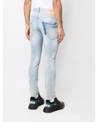 hellblaue enge Jeans mit Destroyed-Effekten von Philipp Plein