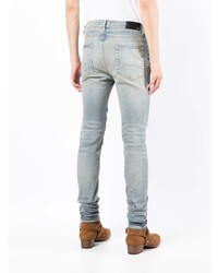 hellblaue enge Jeans mit Destroyed-Effekten von Amiri