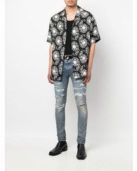 hellblaue enge Jeans mit Destroyed-Effekten von Amiri