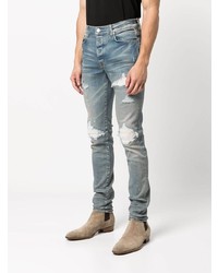 hellblaue enge Jeans mit Destroyed-Effekten von Amiri