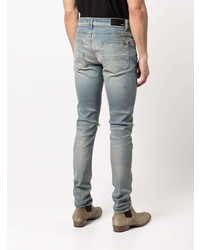 hellblaue enge Jeans mit Destroyed-Effekten von Amiri