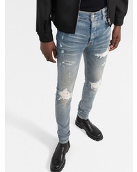 hellblaue enge Jeans mit Destroyed-Effekten von Amiri