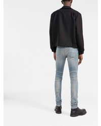 hellblaue enge Jeans mit Destroyed-Effekten von Amiri