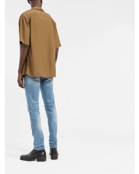 hellblaue enge Jeans mit Destroyed-Effekten von Amiri