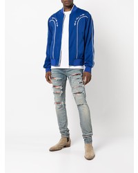 hellblaue enge Jeans mit Destroyed-Effekten von Amiri