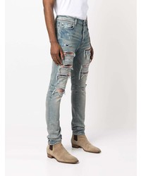 hellblaue enge Jeans mit Destroyed-Effekten von Amiri