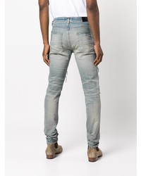 hellblaue enge Jeans mit Destroyed-Effekten von Amiri