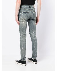 hellblaue enge Jeans mit Destroyed-Effekten von purple brand