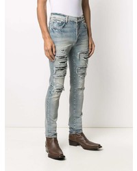 hellblaue enge Jeans mit Destroyed-Effekten von Amiri