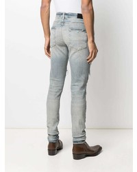 hellblaue enge Jeans mit Destroyed-Effekten von Amiri