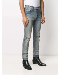 hellblaue enge Jeans mit Destroyed-Effekten von Amiri