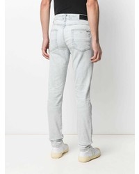 hellblaue enge Jeans mit Destroyed-Effekten von Amiri