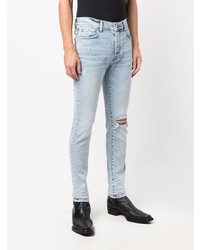 hellblaue enge Jeans mit Destroyed-Effekten von Amiri