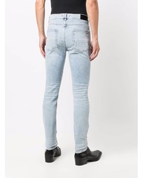 hellblaue enge Jeans mit Destroyed-Effekten von Amiri