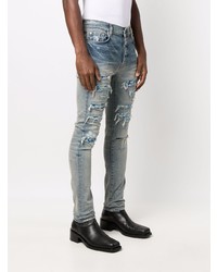 hellblaue enge Jeans mit Destroyed-Effekten von Amiri