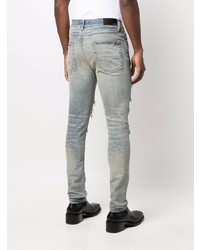 hellblaue enge Jeans mit Destroyed-Effekten von Amiri