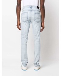 hellblaue enge Jeans mit Destroyed-Effekten von Amiri