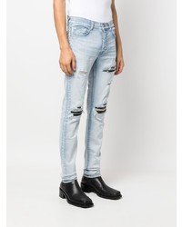 hellblaue enge Jeans mit Destroyed-Effekten von Amiri