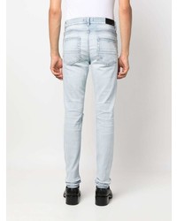 hellblaue enge Jeans mit Destroyed-Effekten von Amiri