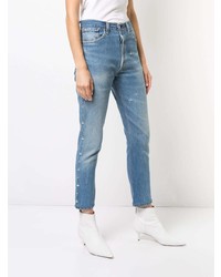 hellblaue enge Jeans mit Destroyed-Effekten von RE/DONE