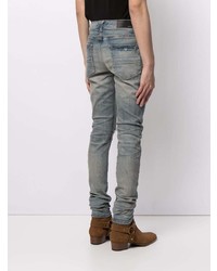 hellblaue enge Jeans mit Destroyed-Effekten von Amiri