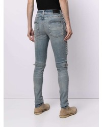 hellblaue enge Jeans mit Destroyed-Effekten von Amiri