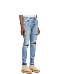 hellblaue enge Jeans mit Destroyed-Effekten von Amiri