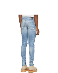 hellblaue enge Jeans mit Destroyed-Effekten von Amiri