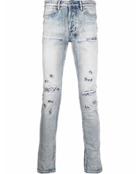 hellblaue enge Jeans mit Destroyed-Effekten von Ksubi